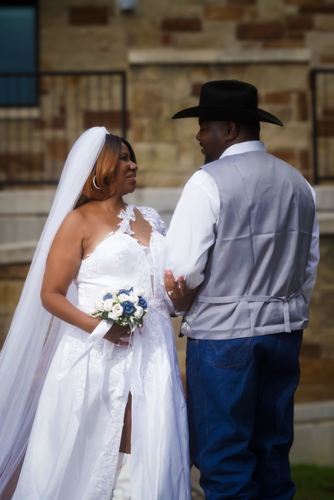 A bride and groom in western wedding attire